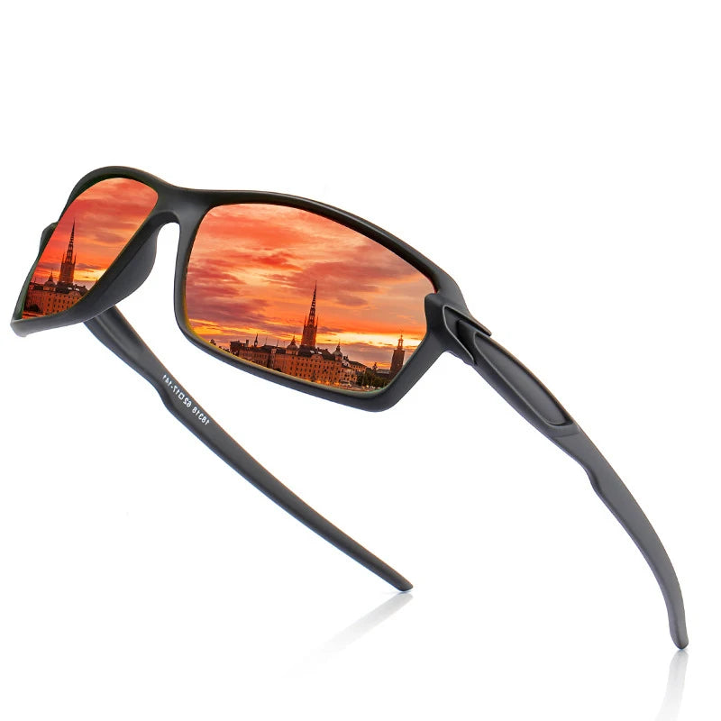 A pair of black polarized sports sunglasses with orange sunset reflections on the lenses.