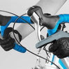 Close-up of hands wearing black cycling gloves and blue riding gloves gripping a bicycle handlebar.