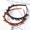 Double layer headband featuring amber and black material with pearl and rhinestone accents