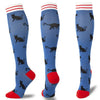 A set of multi-color compression socks featuring black cats on a blue background with red accents.