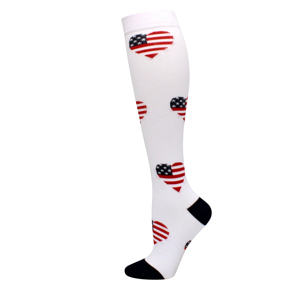 White compression socks with red, white, and blue patriotic heart patterns on the calf and foot.