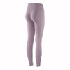 A close-up view of a mauve high-waist seamless yoga legging worn by a model.