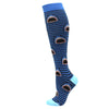 Blue and black striped compression socks featuring repeating shark tooth patterns