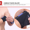 A hand is applying a black elastic wrist strap to a forearm, demonstrating the firm fit of a compact paste velcro product.