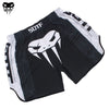 Black and white athletic shorts featuring a stylized skull design for combat sports.