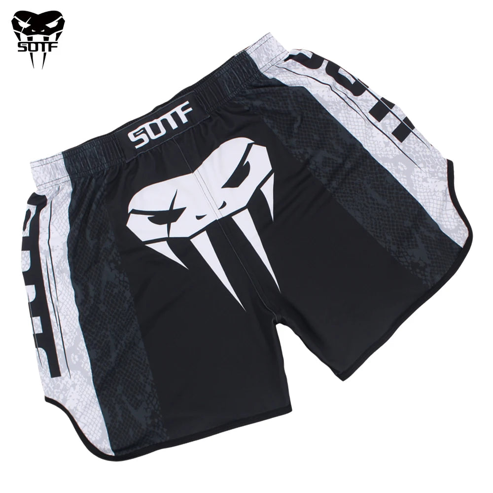 Black and white athletic shorts featuring a stylized skull design for combat sports.