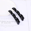 A pair of black double layer headband featuring pearl and rhinestone embellishments.
