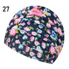 A dark blue and pink floral patterned elastic nylon turban swimming cap.