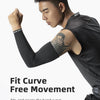 A man wearing black breathable cycling arm sleeves performs a physical movement exercise.
