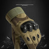 A close-up view of olive green tactical sports gloves with black palm protection against a dark background.