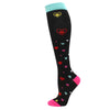 Black compression socks with heart patterns and a teal cuff.