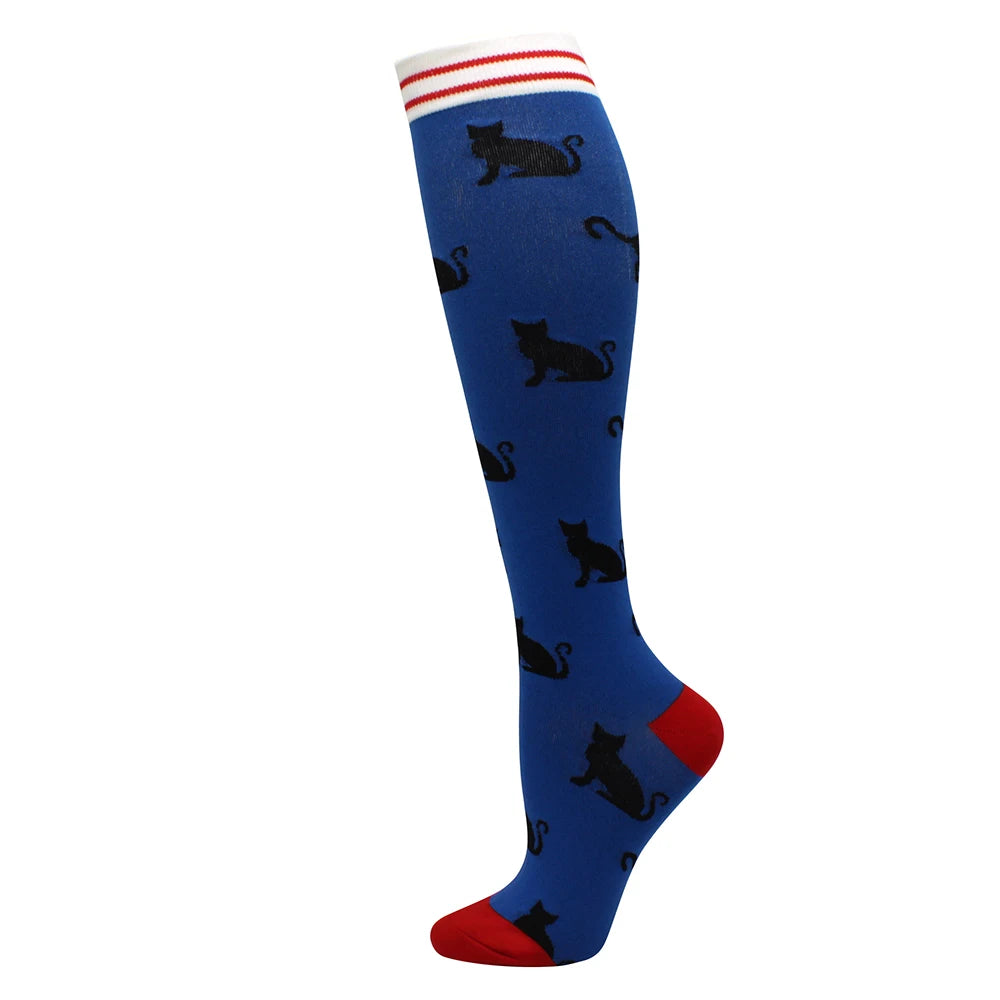 Blue compression socks with a red cuff featuring black cat designs.