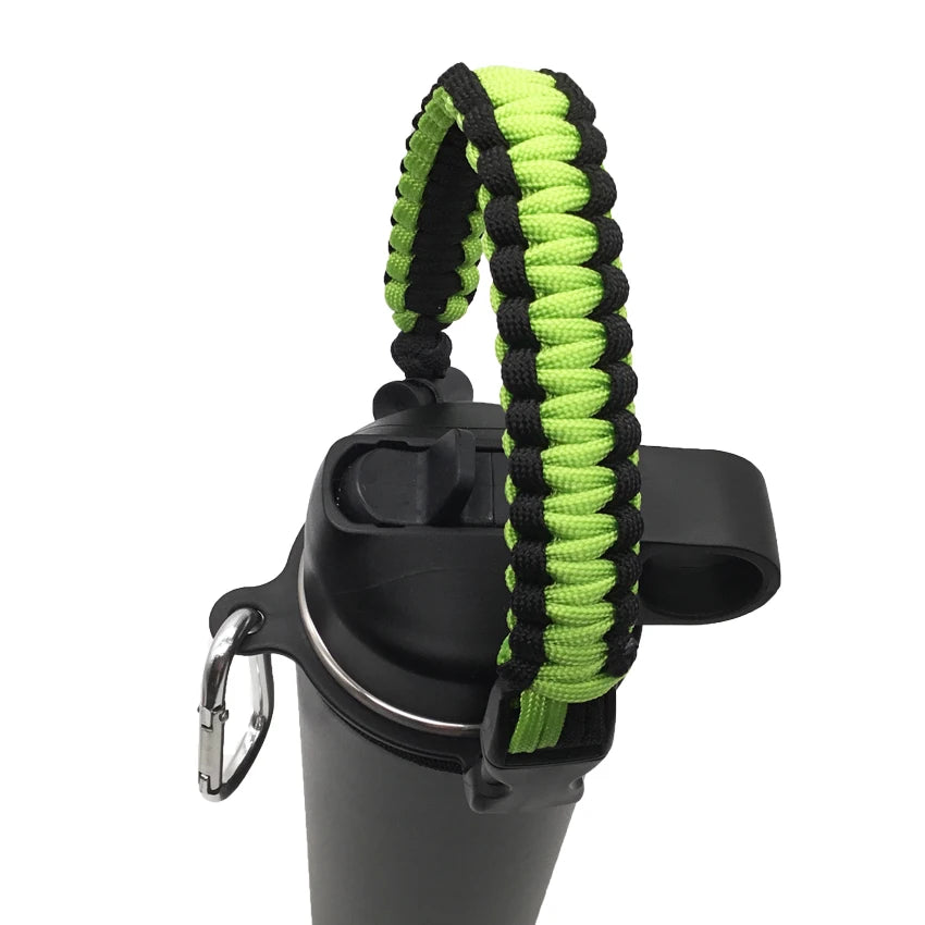 A black water bottle strap made of green and black paracord is shown attached to a bottle.