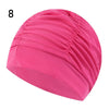 Pink elastic nylon turban swimming cap shown from the side.