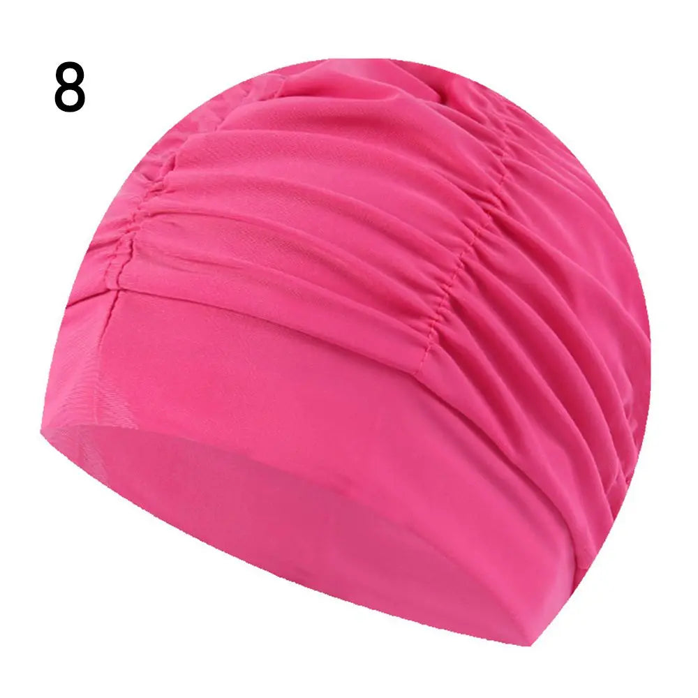 Pink elastic nylon turban swimming cap shown from the side.