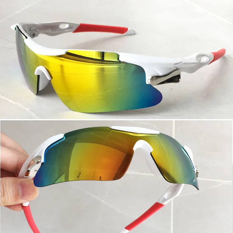 A pair of yellow-tinted sport sunglasses with white frames and red accents are shown in a close-up view.