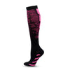 A pair of black graduated compression socks with pink accents and a patterned design.