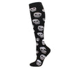 Black compression socks featuring a repeating pattern of white skulls.