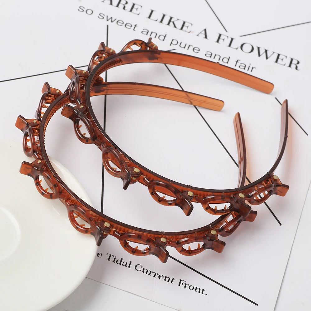 A double layer headband made of amber-colored material adorned with small pearls and rhinestones.