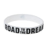 White silicone elastic bracelet with black text that reads Road to the Dream