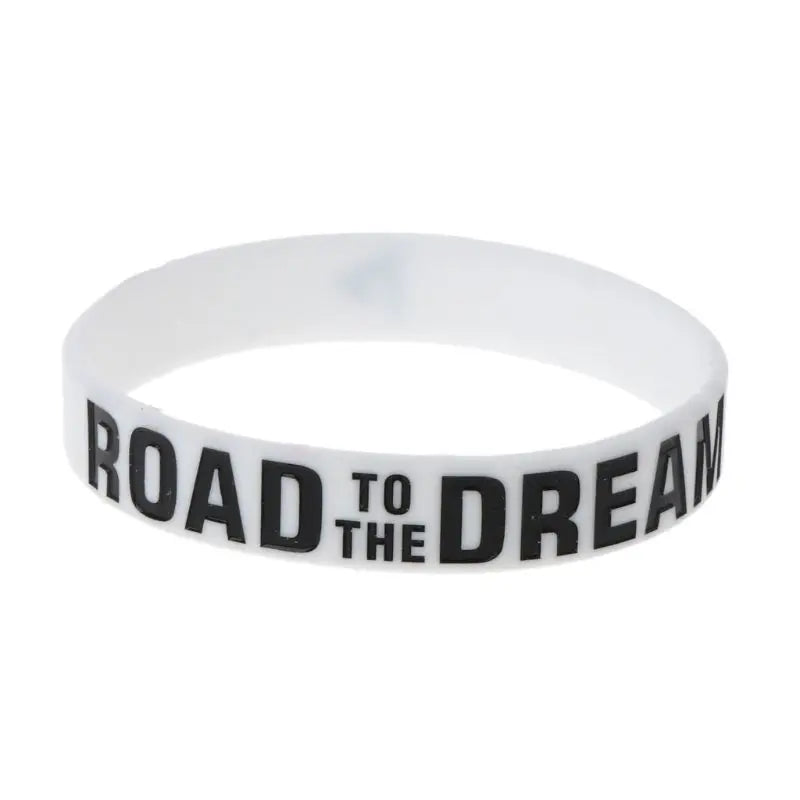 White silicone elastic bracelet with black text that reads Road to the Dream
