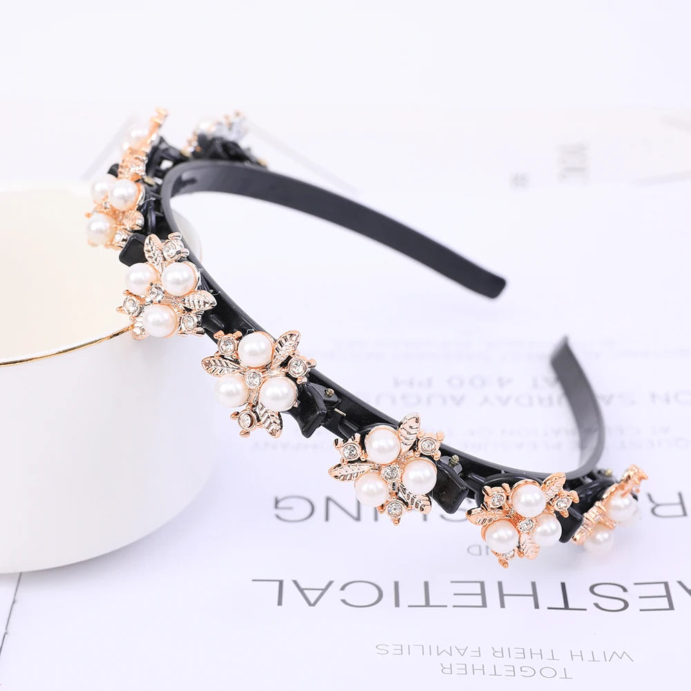 Black headband adorned with white pearls and rhinestones for a double layer accessory.