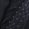Close-up of a black body shaper waist trainer corset with visible stitching and metal eyelets.