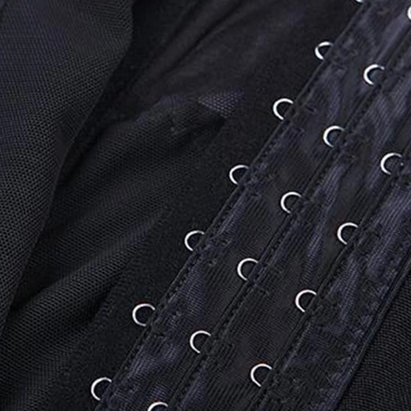 Close-up of a black body shaper waist trainer corset with visible stitching and metal eyelets.