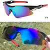 A pair of V-4 sport sunglasses with black frames and multi-colored lenses are shown in use outdoors.