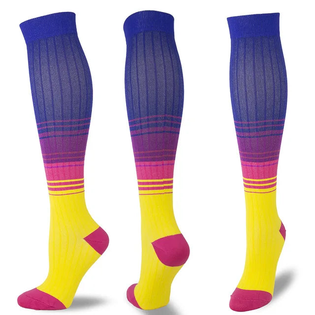 A set of multi-color compression socks featuring purple, pink, and yellow stripes.