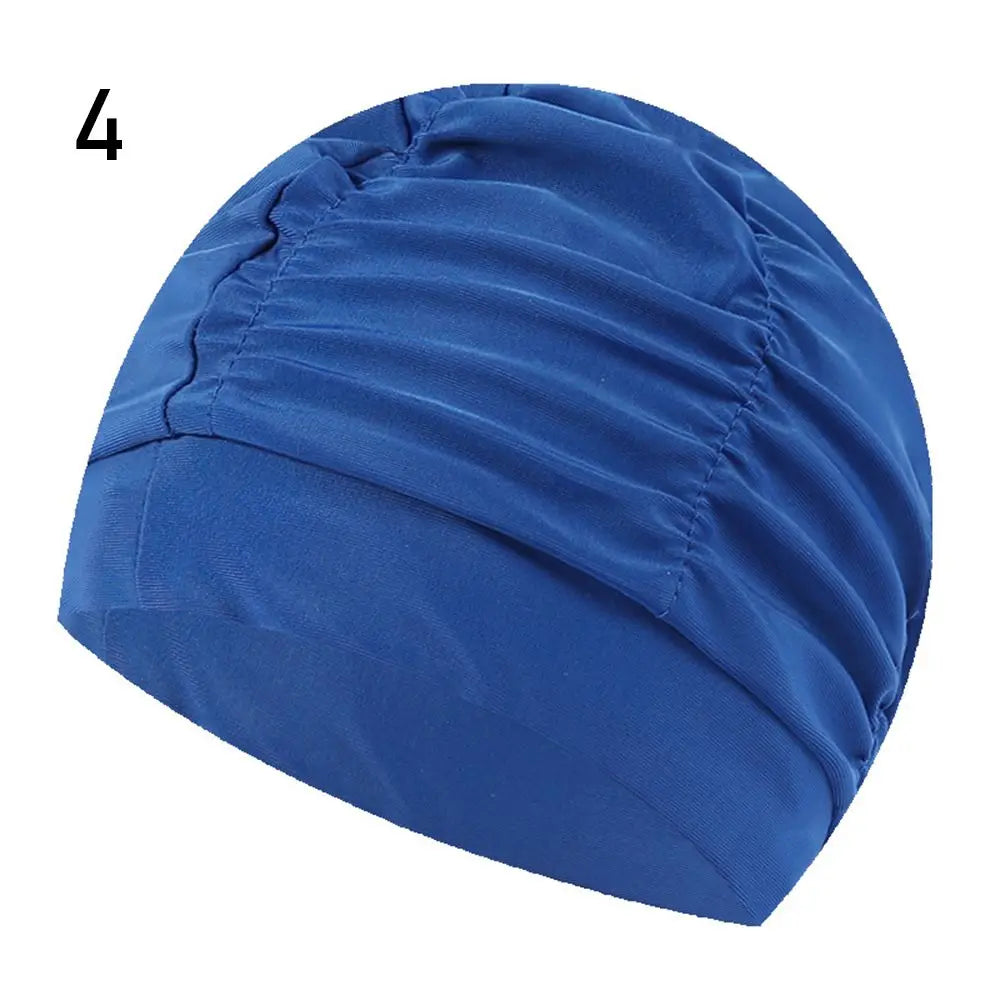 A royal blue elastic nylon turban swimming cap shown from the side.