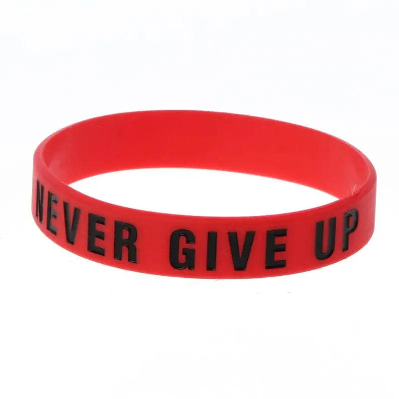 A red silicone elastic bracelet with the black text NEVER GIVE UP on it.