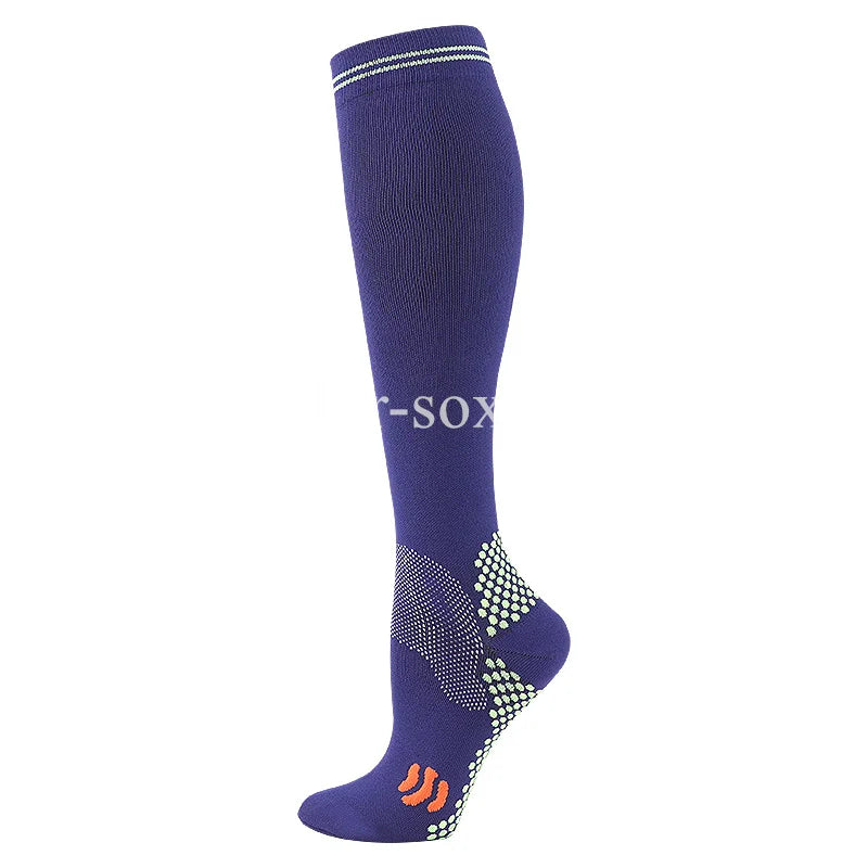 A navy blue graduated compression sock with a bright green patterned toe and heel.