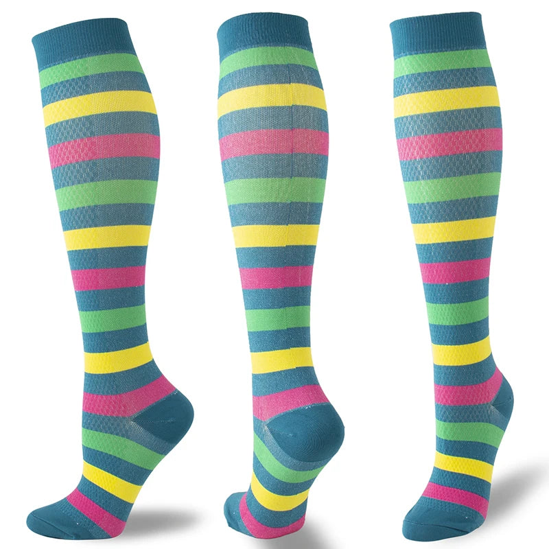 A set of multi-color striped compression socks in shades of blue, green, yellow, and pink.