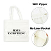 White canvas tote bag with black text Jesus Everything featuring a zipper and no liner pocket.