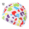 A colorful elastic nylon turban swimming cap with a heart pattern design.