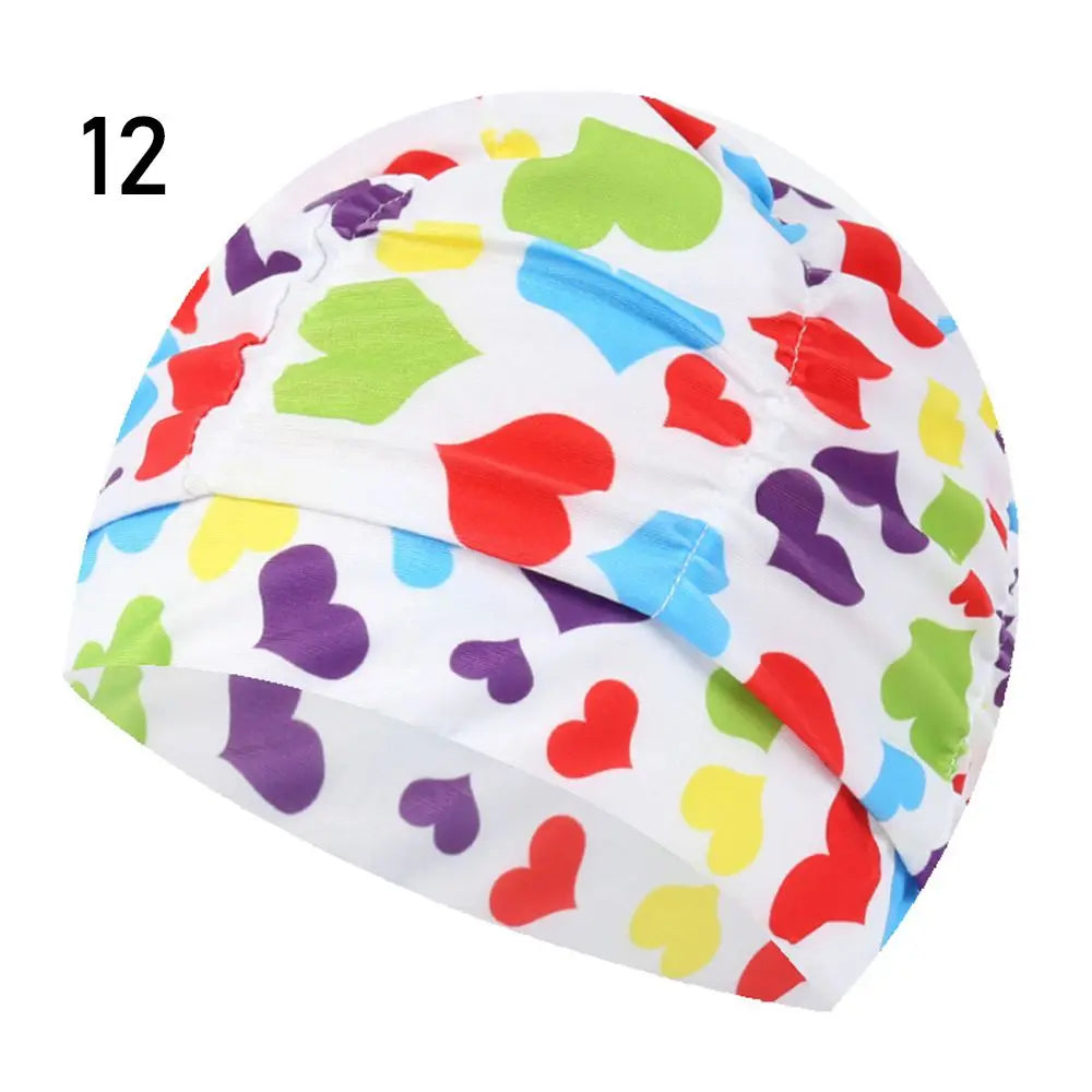 A colorful elastic nylon turban swimming cap with a heart pattern design.