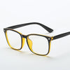A pair of square full frame optical glasses with yellow-tinted lenses and black frames.