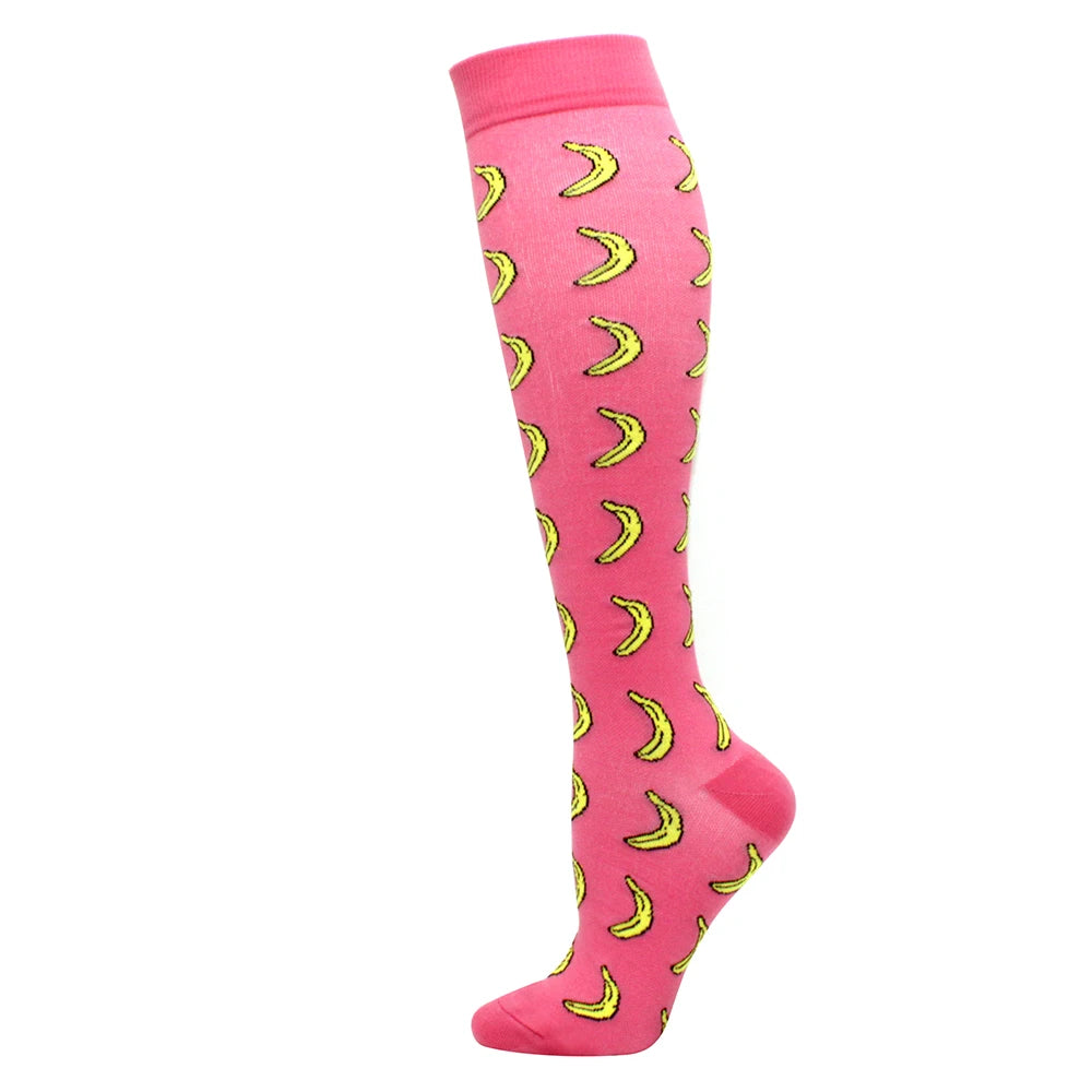 Pink compression socks with yellow crescent moon patterns
