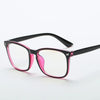 A pair of pink and black square full frame optical glasses viewed from above.