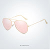 Pink polarized pilot sunglasses with gold-toned metal frames shown against a white background.
