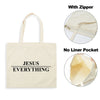 A beige canvas tote bag with black text reading JESUS EVERYTHING, shown with and without a zipper and a liner pocket.