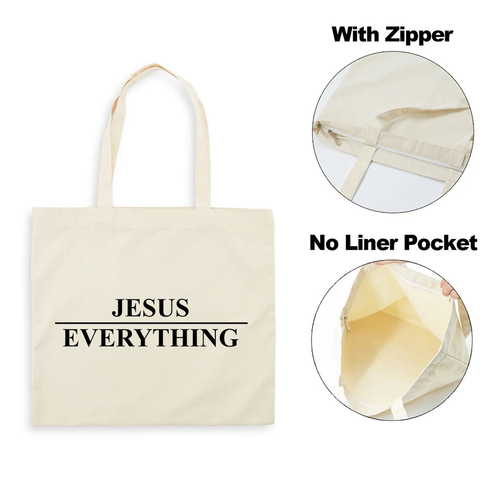 A beige canvas tote bag with black text reading JESUS EVERYTHING, shown with and without a zipper and a liner pocket.
