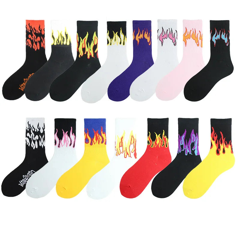 A variety of women's crew socks featuring various flame patterns in colors including black, white, purple, pink, orange, and 