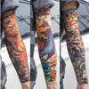 A set of reusable UV protection tattoo arm sleeves featuring colorful, intricate designs on the forearm.