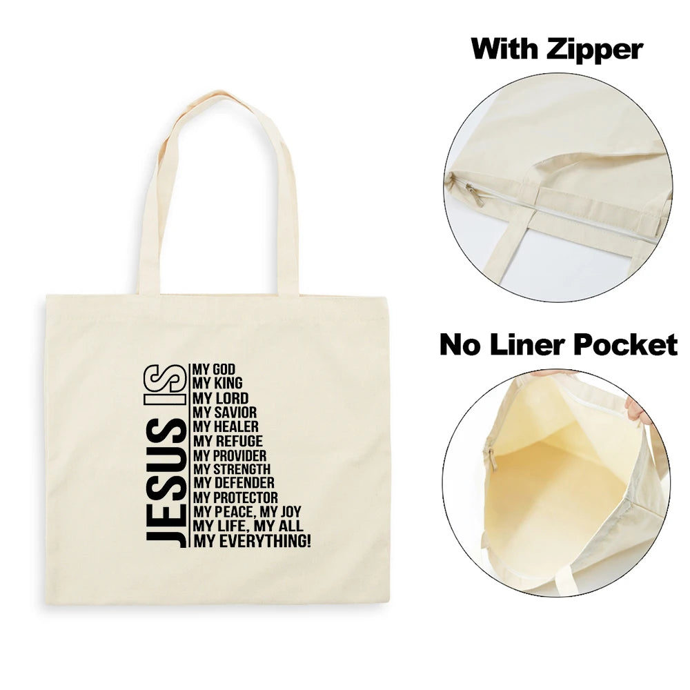 A beige canvas tote bag featuring black text about Jesus and faith, shown with a zipper and no liner pocket.