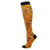 A pair of black and orange tiger-striped medical grade compression socks.