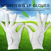 Pair of white women's golf gloves displayed on a green grass background.