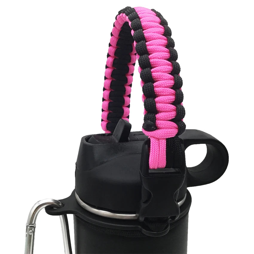 A black water bottle with a pink and black paracord strap attached.