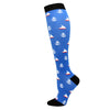 Blue compression socks featuring white anchor and sailboat patterns for circulation support